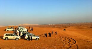 Private desert safari Dubai with luxury 4x4 driving across golden sand dunes